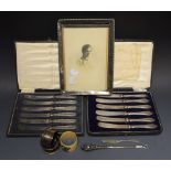 A set of six silver hafted butter knives, cased, Birmingham 1915; another,