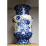 A Victorian Doulton floor standing vase decorated with blue and white flowers and pomegranates,