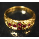 A 9ct gold ring, set with six garnets, 4.