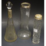 A cut glass silver top scent bottle, Birmingham 1921; A cut glass jar,