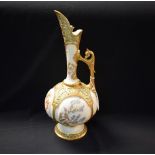 A large Royal Worcester Persian inspired ewer, printed and painted with stylised floral sprigs,