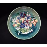 A large Moorcroft Spring Flowers pattern bowl, decorated with colourful blooms and slender leaves,