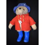 A Gabriel Designs Paddington bear, blue hat and wellingtons,