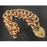 A 9ct rose gold curb link bracelet, heart shaped padlock clasp, 17.