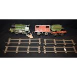 Hornby O Gauge - a 0-4-0 tank locomotive tender, green and black livery, RN1842, two goods wagons,