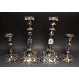 A pair of silver on copper table candlesticks; another pair,