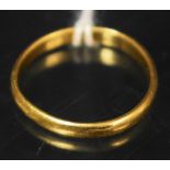 A 22ct gold wedding band, 2.