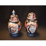 A pair of Japanese Imari vases and covers