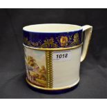 A Derby Named View Porter mug, painted with In Italy within a gilt cartouche,