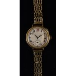 A vintage 18ct gold cased dress watch, textured silvered dial, Arabic numerals, minute track,
