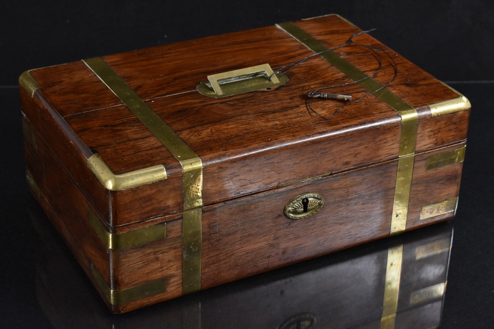A 19th Century rosewood lady's writing box, brass bound, flush handle engraved Emily,