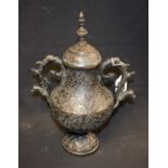 An Indian dark patinated bronze two-handled vase and cover, lofty knop finial,
