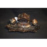 A Black Forest novelty inkstand, the central stamp box as an alpine chalet,