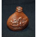 A 19th century brown saltglazed stoneware oval flask, possibly Brampton,