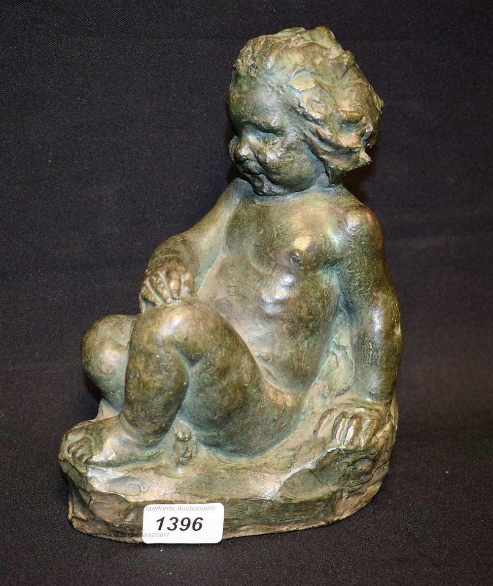 F George, a carved hardstone model of a chubby young child,