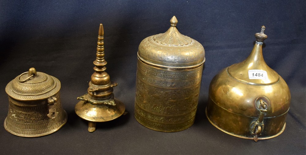 An Indian brass spice box, domed cover with lofty spire finial, pad feet, 21cm high,