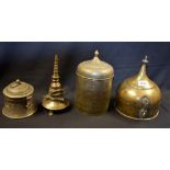 An Indian brass spice box, domed cover with lofty spire finial, pad feet, 21cm high,