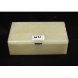 An Art Deco silver mounted white onyx table cigarette box, hinged cover enclosing twin compartments,