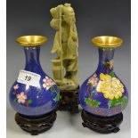 A pair of Japanese cloisonne vases, decorated with yellow and pink flowers on a blue ground,