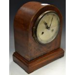 An Edwardian mahogany mantel clock, outlined throughout with barber-pole stringing, c.