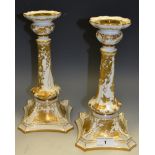 A pair of Royal Crown Derby Gold Aves pattern Castleton candlesticks, with spreading square bases,