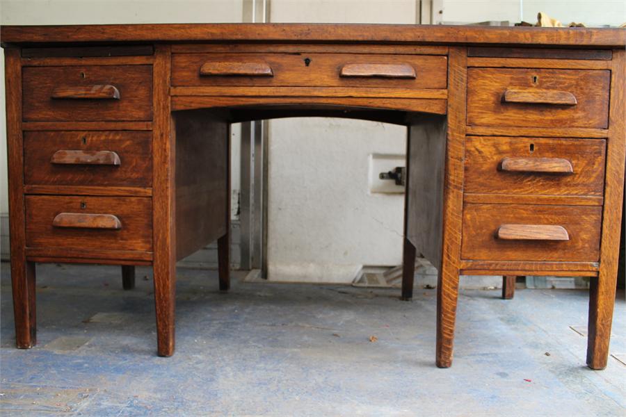 An oak desk - Second Quarter 20th Century, with slides.