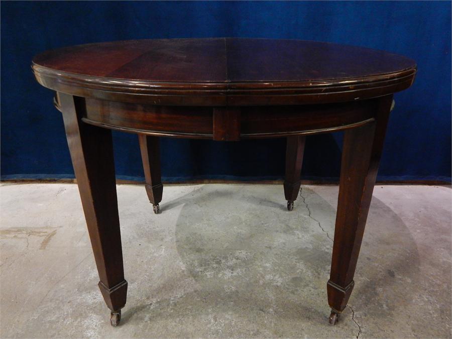 Late 19th Century Mahogany, round and oval extending wind-out table and 1 leaf. 108cm by 150cm (