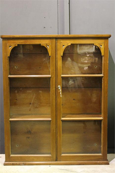 A 19th Century Walnut wall mounted display cabinet with glazed doors. (Key in Office)