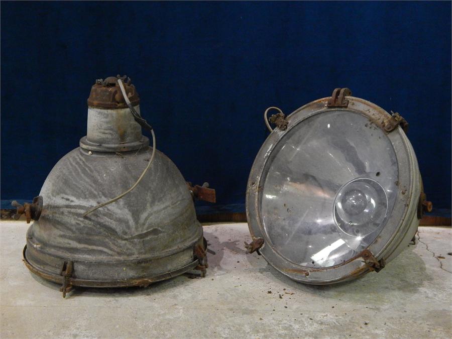 A Pair of Galvanised Industrial Lamps with Glass Covers, could be hung on chains or floor mounted.