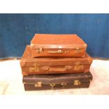 3 vintage leather suitcases