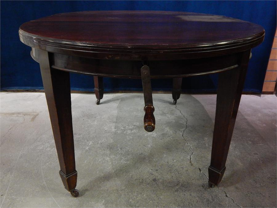 Late 19th Century Mahogany, round and oval extending wind-out table and 1 leaf. 108cm by 150cm ( - Image 3 of 3