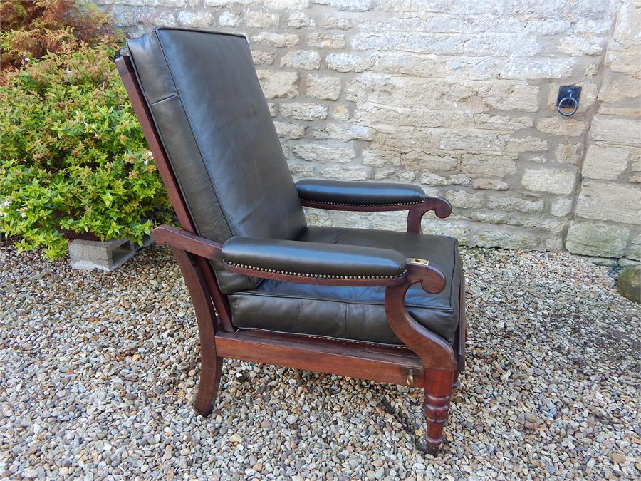 A William iV Metamorphic Adjustable Reclining Mahogany Bergere Library Armchair, with pull out leg