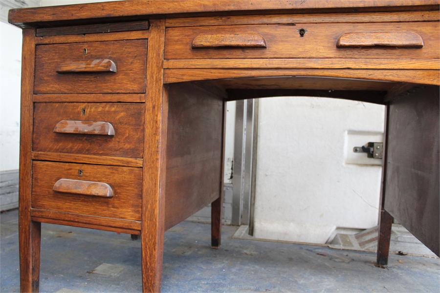 An oak desk - Second Quarter 20th Century, with slides. - Image 2 of 8