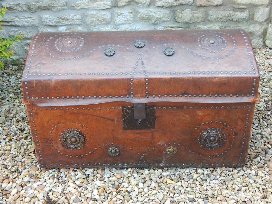 Leather clad brass studded dometop trunk. - Image 2 of 8