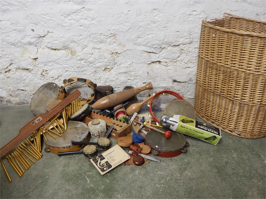 Musical instruments, tambourines, multi guiro. In wicker basket. - Image 2 of 2