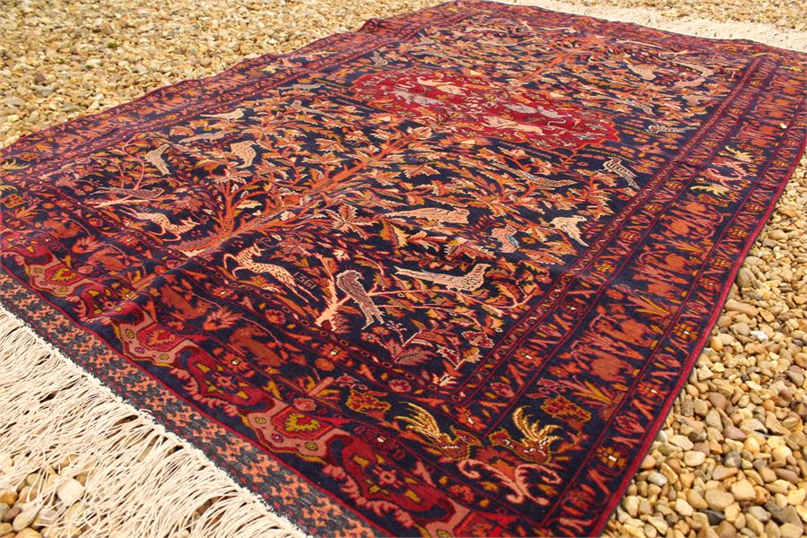 A mid 20th century afghan, tribal silk and wool on silk rug, dated 1361 in the Farsi calendar a very - Image 11 of 12