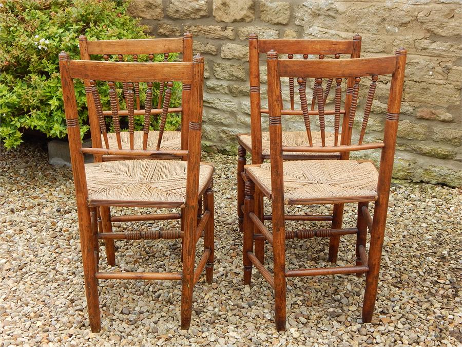 A Set of Four Matching Elm Country Kitchen Rush Seated Side Chairs, turned spindle Backs in a fan - Image 9 of 12
