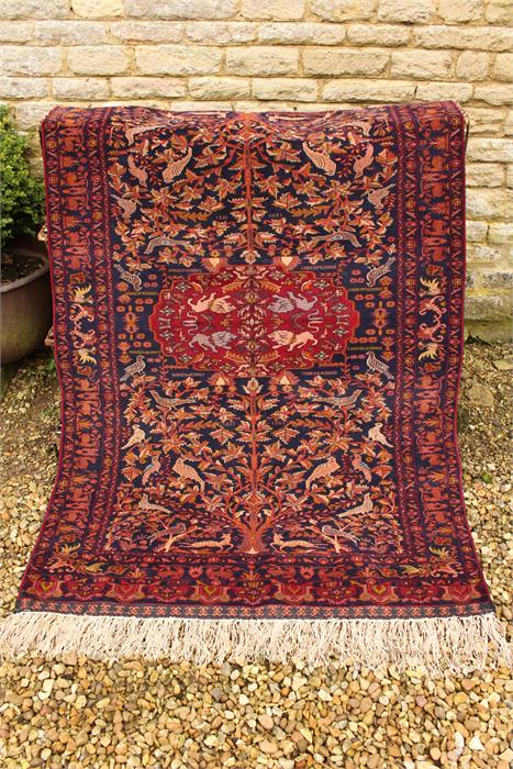 A mid 20th century afghan, tribal silk and wool on silk rug, dated 1361 in the Farsi calendar a very