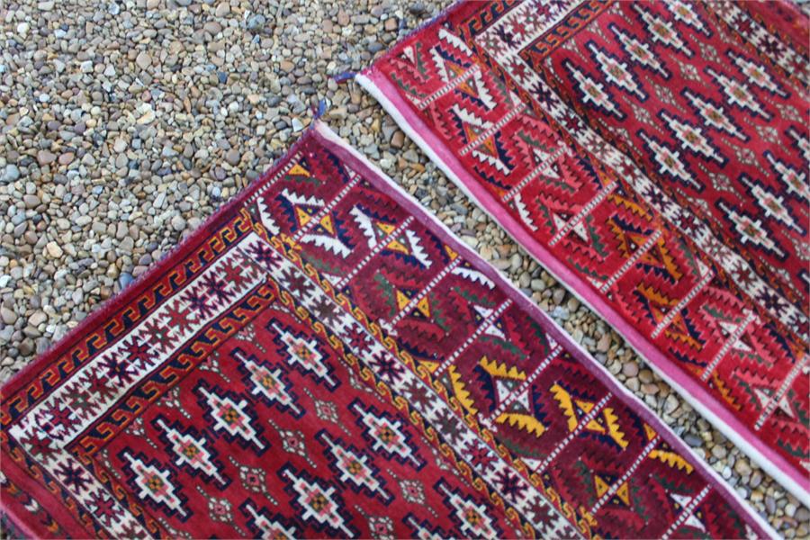 A pair of fine quality Mid 19th century turkoman yamut, very fine weave torbas;in rich red and - Image 12 of 14