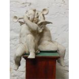 A pair of stone-effect resin sitting cherubs / putti. Modern