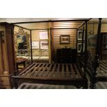 A Carved Four Poster bed. 7ft by 65" wide, 79" high, mattress base height 19 1/2", would suit 62"