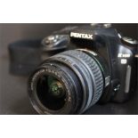 Pentax digital K100 with Pentax-DA SMC 18-55mm f3.5-5.6 lens no. 5802984