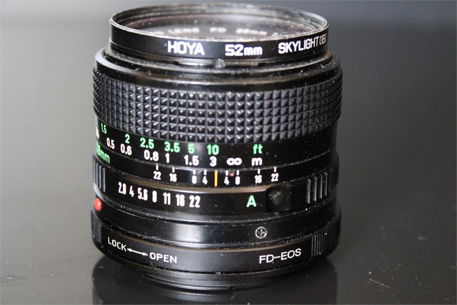 A Canon lens FD 28mm 1:2.8 No. 968453 Fitted with HOYA 52mm Skylight