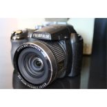 A Fuji Film Finepix s 14 megapixels digital camera no. 1SB3851 24x super wide lens