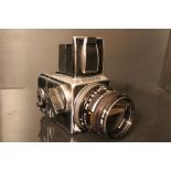 A Hasselblad 503Cx Camera with Carl Zeiss Planar f2.8 80mm lens no. 7145463 along with a tan leather