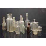 A quantity of glass bottles inc clear glass "Dulce" table waters - Peterborough & Stamford