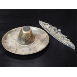 A Mexican Silver Sombrero Shaped Ashtray and a lead battleship - British Made.