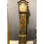 An early 20th century oak cased grandmother longcase clock with spiral columns