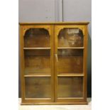 A 19th Century Walnut wall mounted display cabinet with glazed doors. (Key in Office)