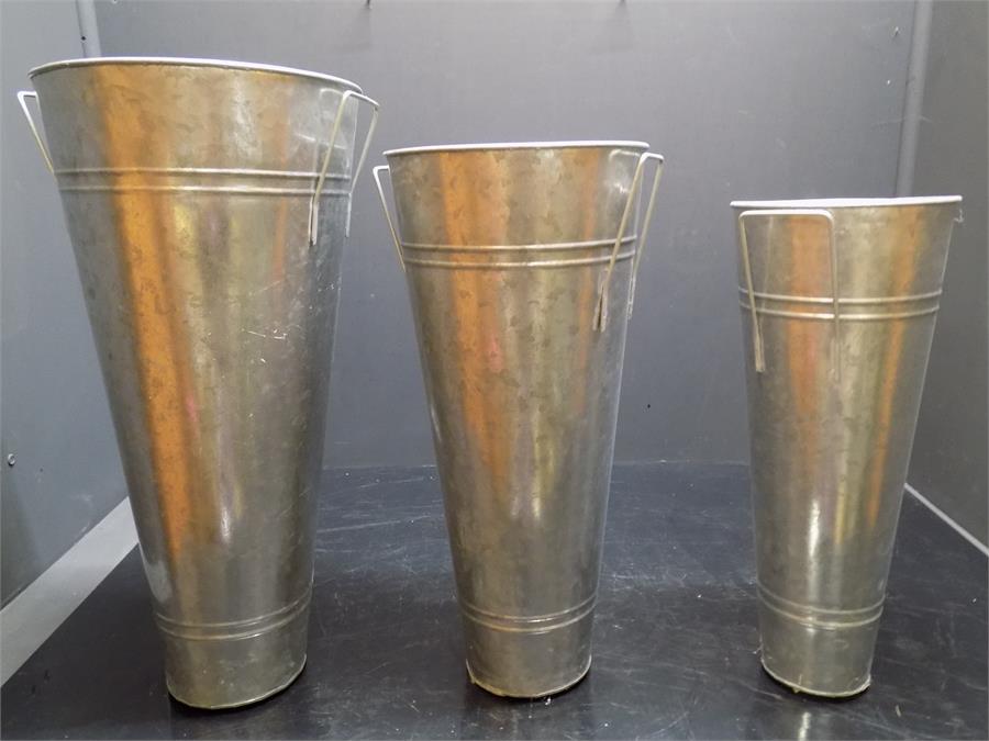 three galvanized pots